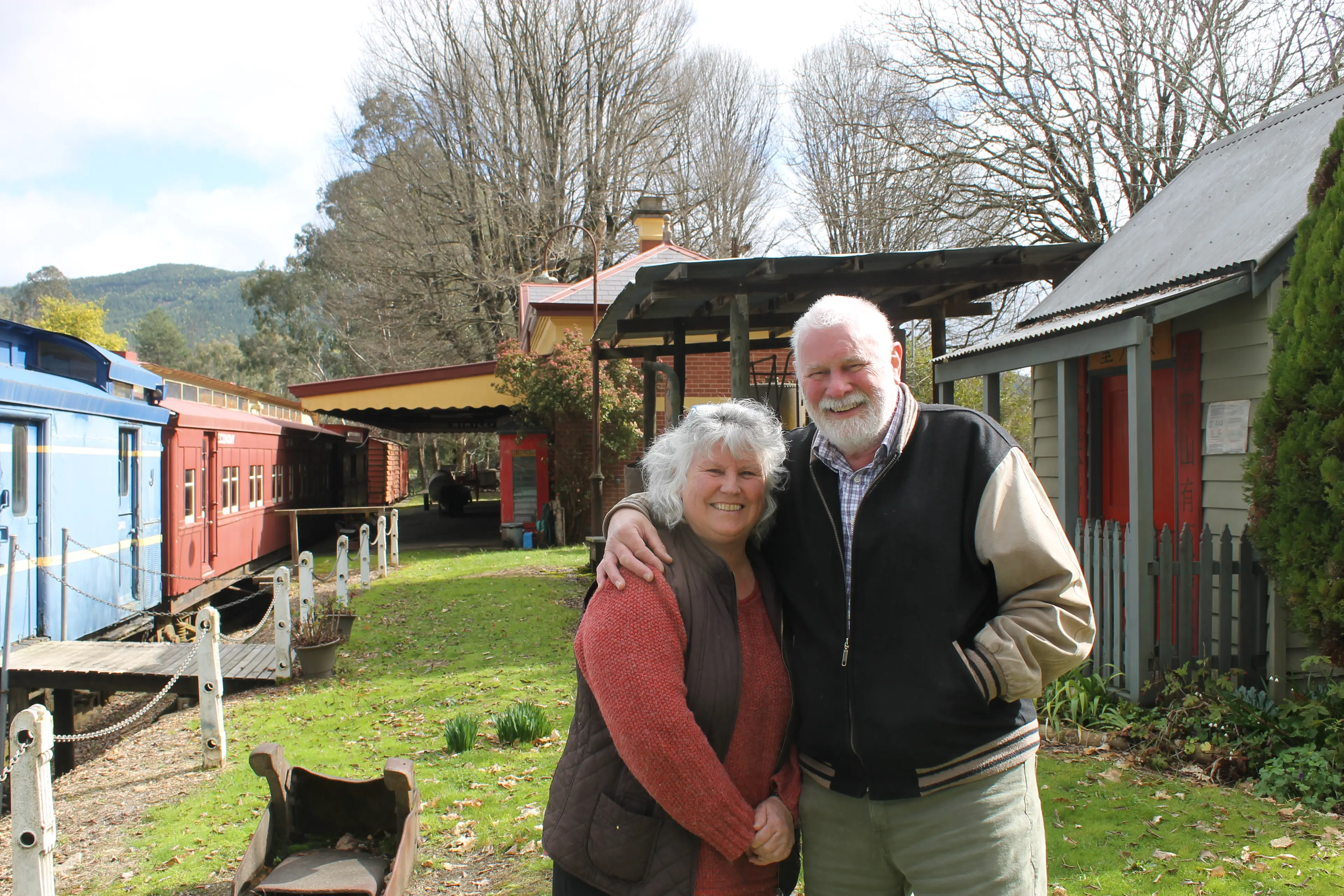 <p>TREASURED TIME CAPSULES:  Bright & District Historical Society treasurer Renata and president Tony Strachan have arranged intensive restoration works on the old railway carriages, which look as if they are ready to be coupled up and shunted back to Wangaratta. PHOTO: Phoebe Morgan</p>\\n