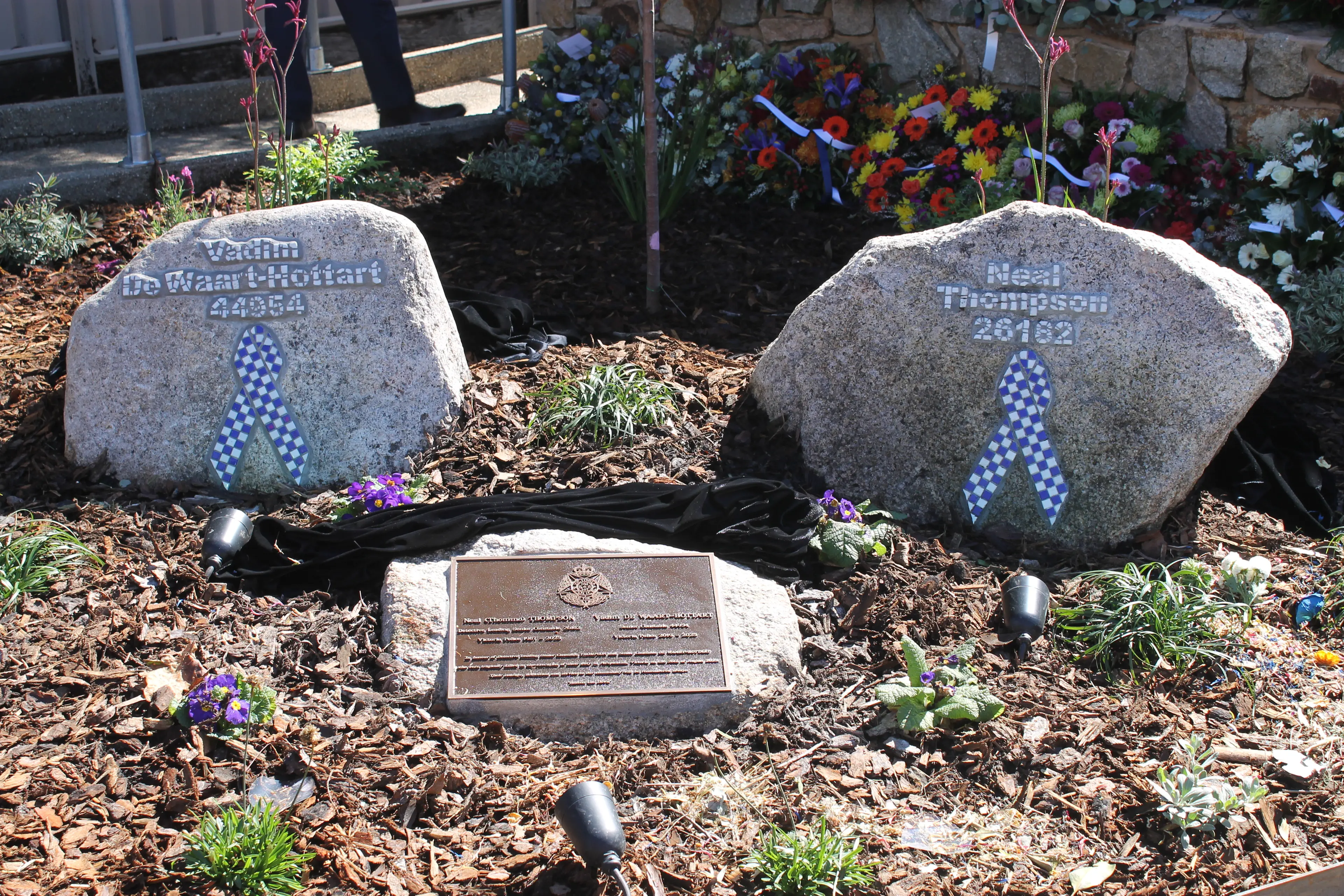 <p>PERMANENT TRIBUTE: The memorial stones honouring Detective Leading Senior Constable Neal Thompson and Senior Constable Vadim de Waart-Hottart outside Bright Police Station. PHOTO: Phoebe Morgan</p>\\n