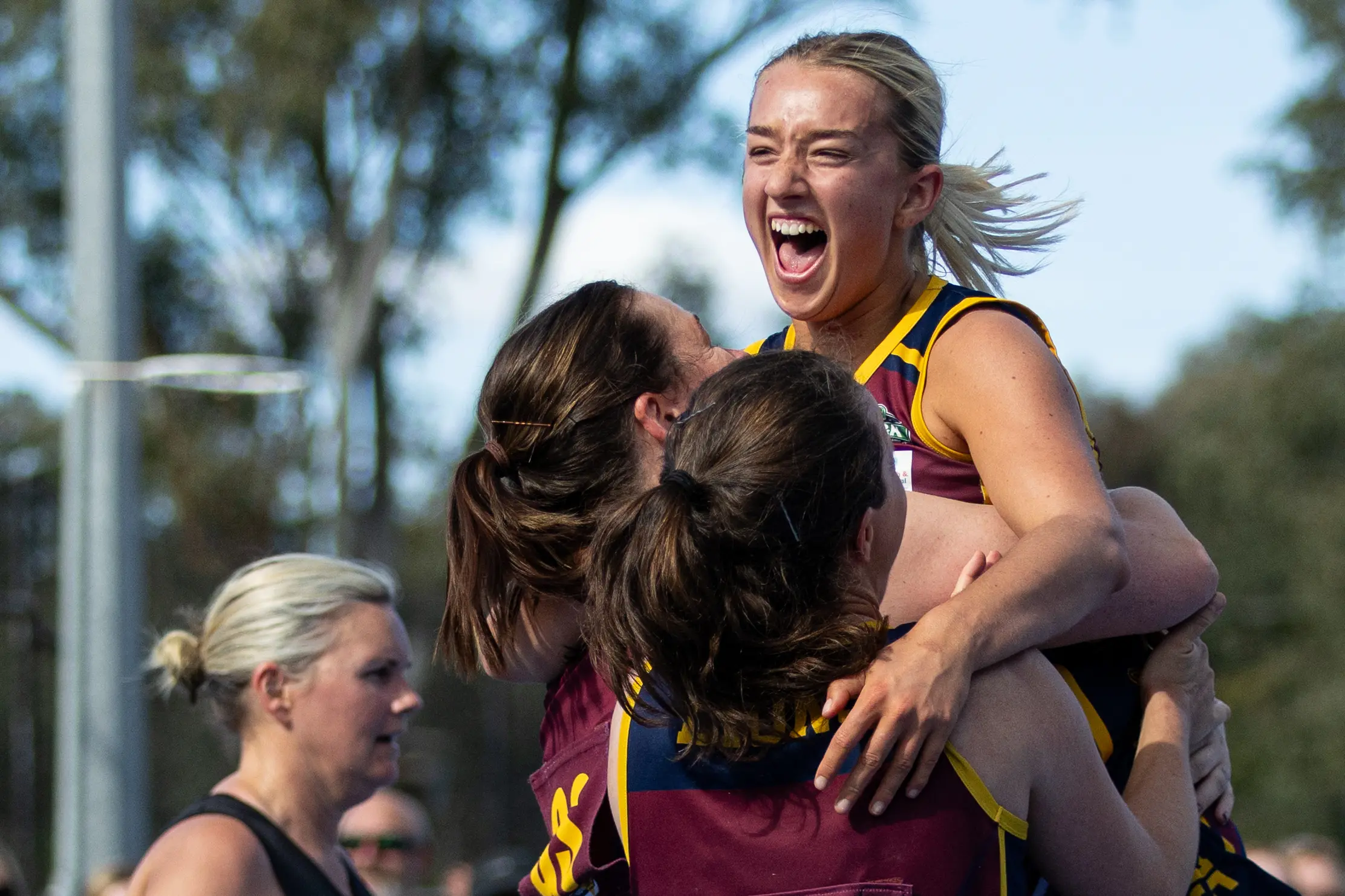 <p>HAPPY DAYS: Ebony Newton and the Lions celebrate at the final horn of the B grade. PHOTOS: Marc Bongers</p>\\n