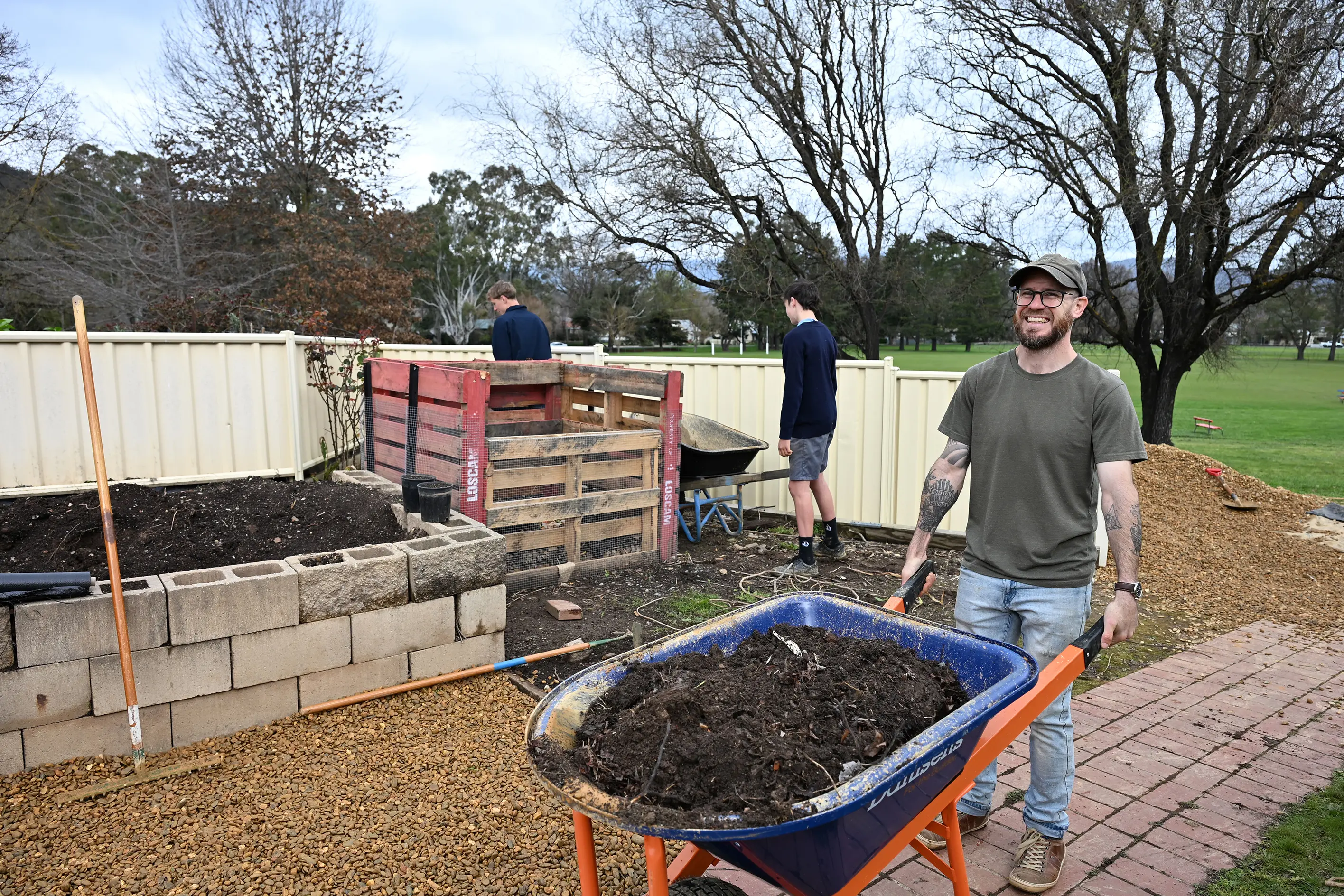<p>MOVING DIRT: Teacher Jarrett Owen, helped by students, have been creating Marian College\\'s new and expansive veggie garden.</p>\\n